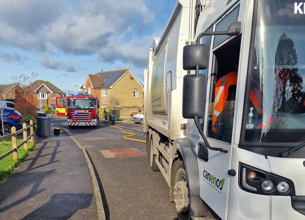 Fire truck parked behind a Canenco refuse lorry