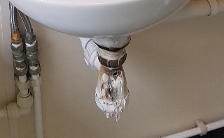 Melted sink waste trap