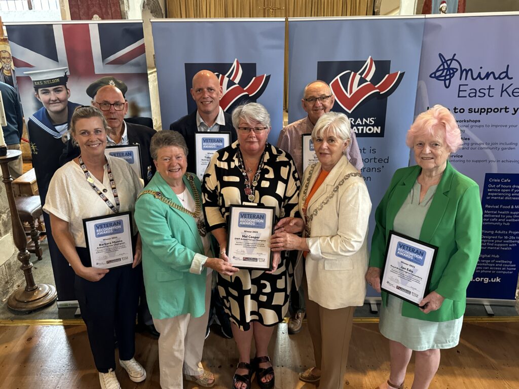 Canterbury veterans holding their awards with the Lord Mayor and Lady Mayoress