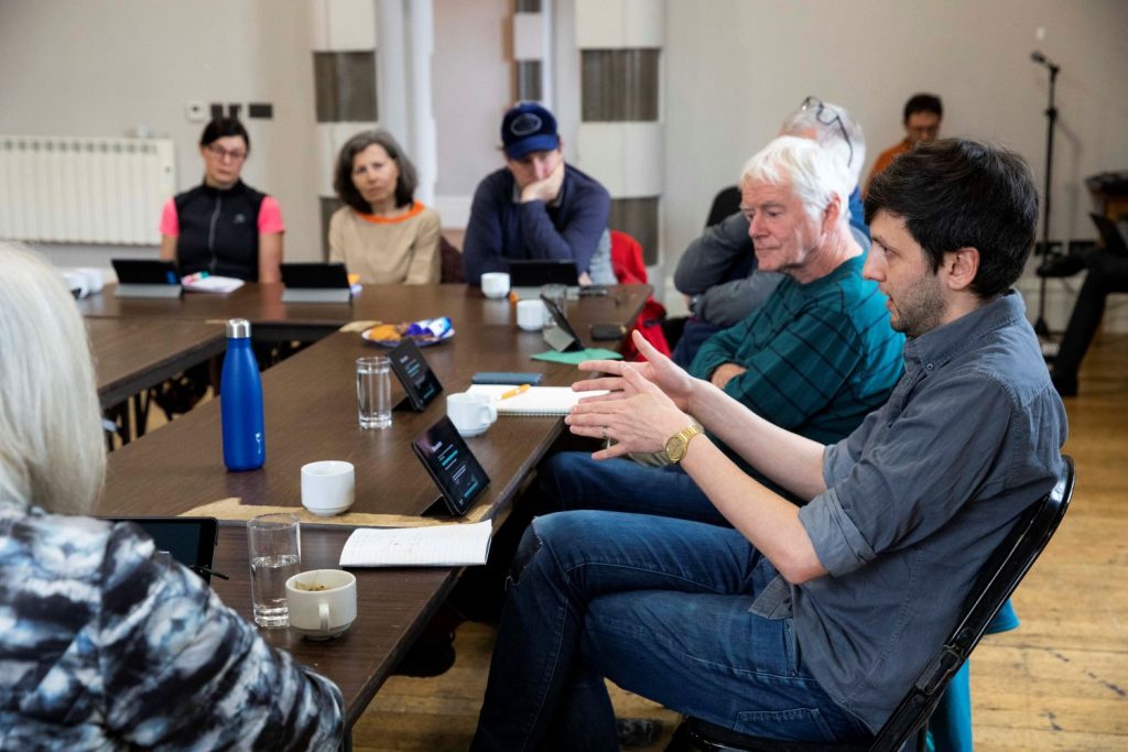 People in a discussion in a Strategy Room workshop