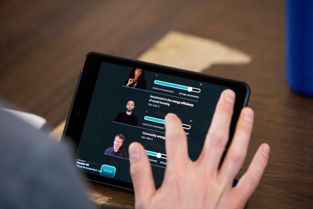 Someone voting on a tablet in a Strategy Room workshop