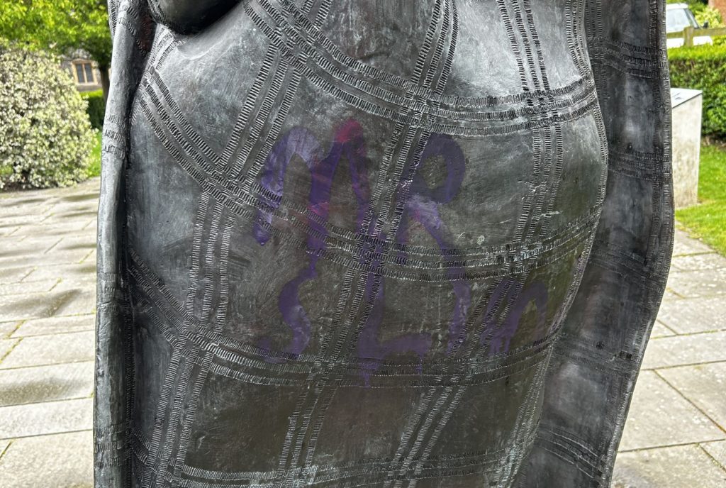 Graffiti tag on a statue