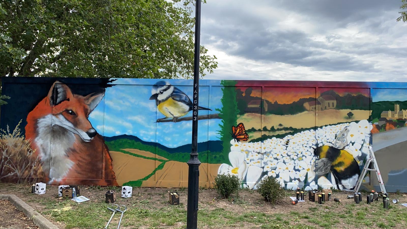 Building site hoarding transformed into vision of nature's wonder