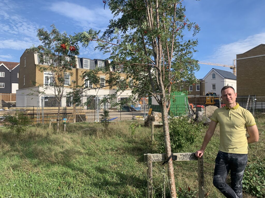 Leader of Canterbury City Council, Ben Fitter-Harding, standing next to a tree in front of Kingfisher Close 
