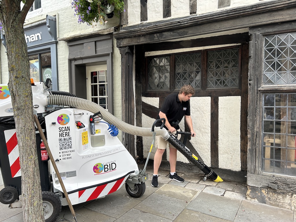 Canterbury BID staff tidying up shop front with The Becket machine