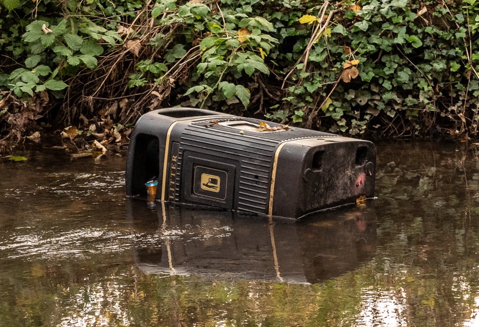 Litter bin in the river Stour