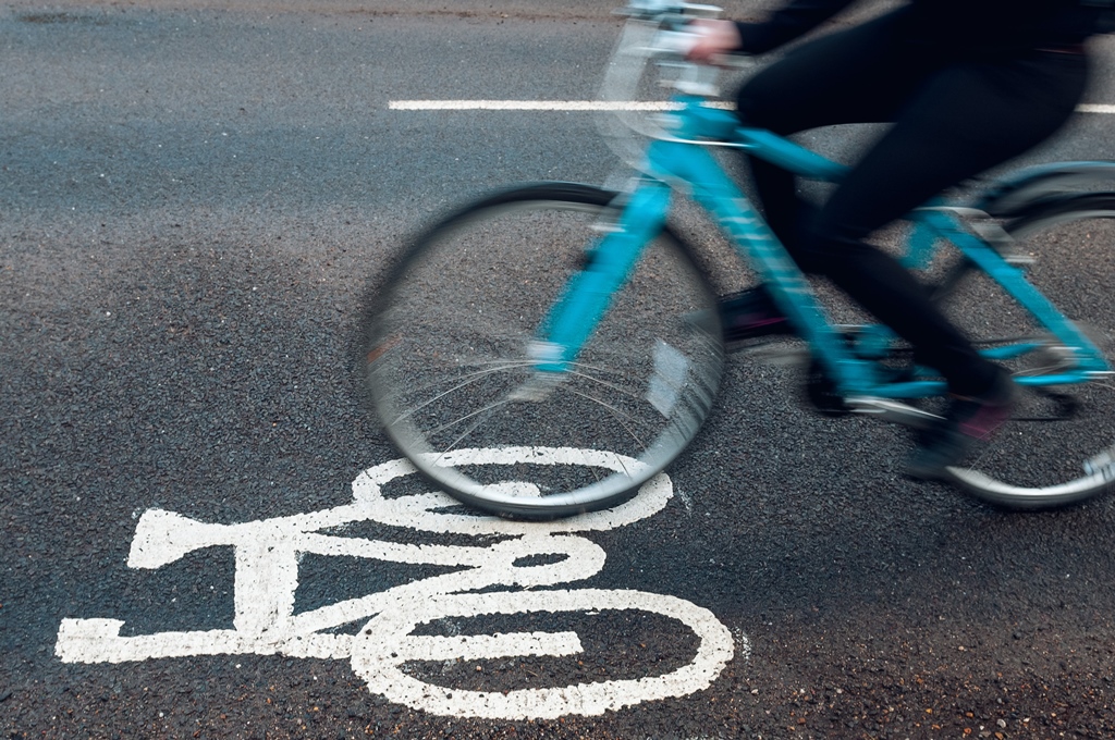 Image of someone cycling on the road