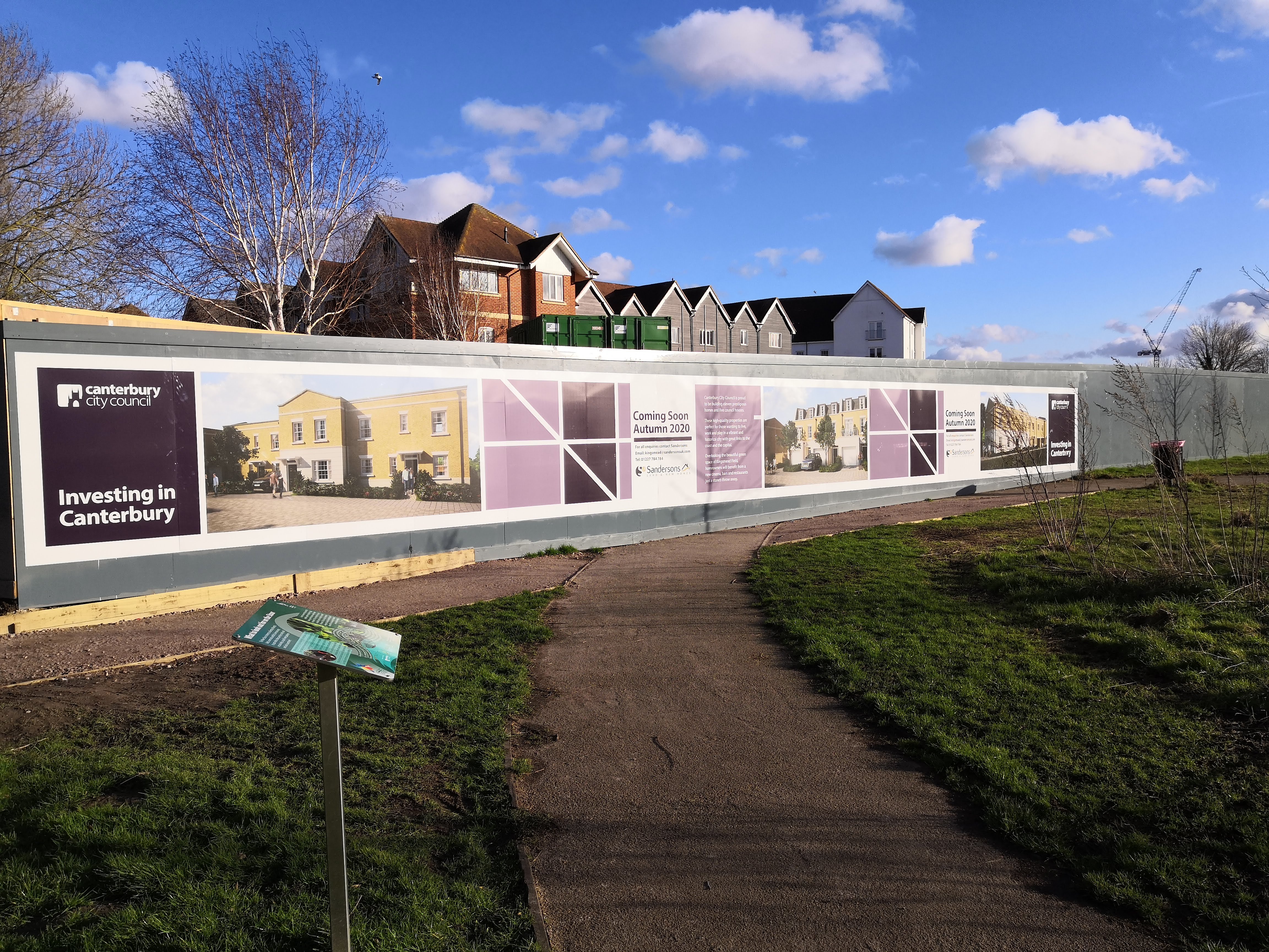 Hoardings are up on the site of the new homes