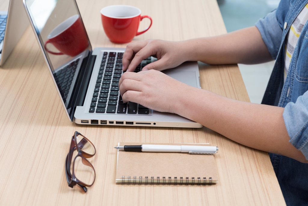 Image of someone working on a laptop