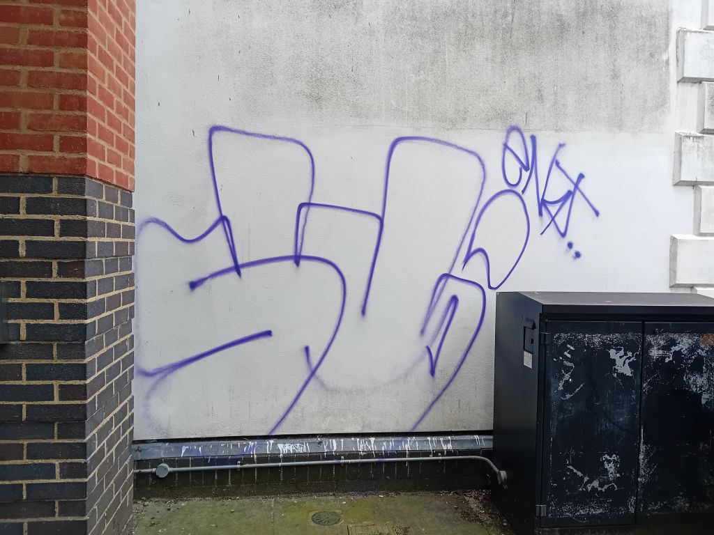 Tag on a wall in Canterbury